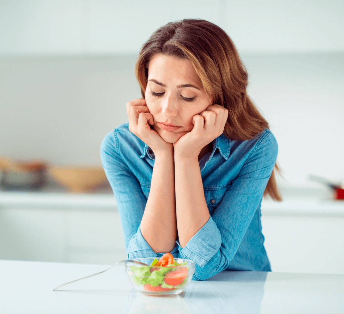 Girl with tomatoes in bowl with salad